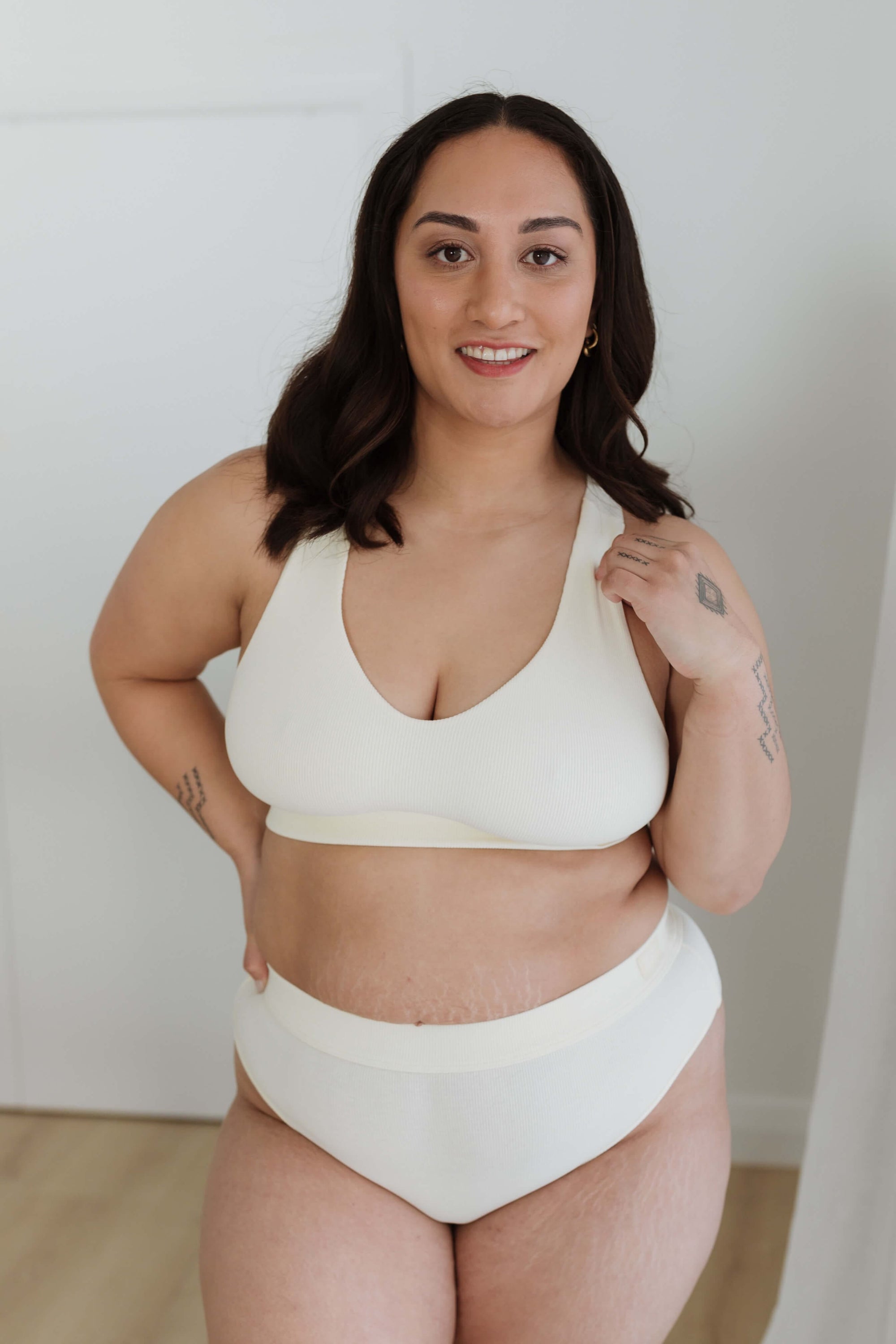 Here we have our Model displaying our cream everyday crop bra XL set