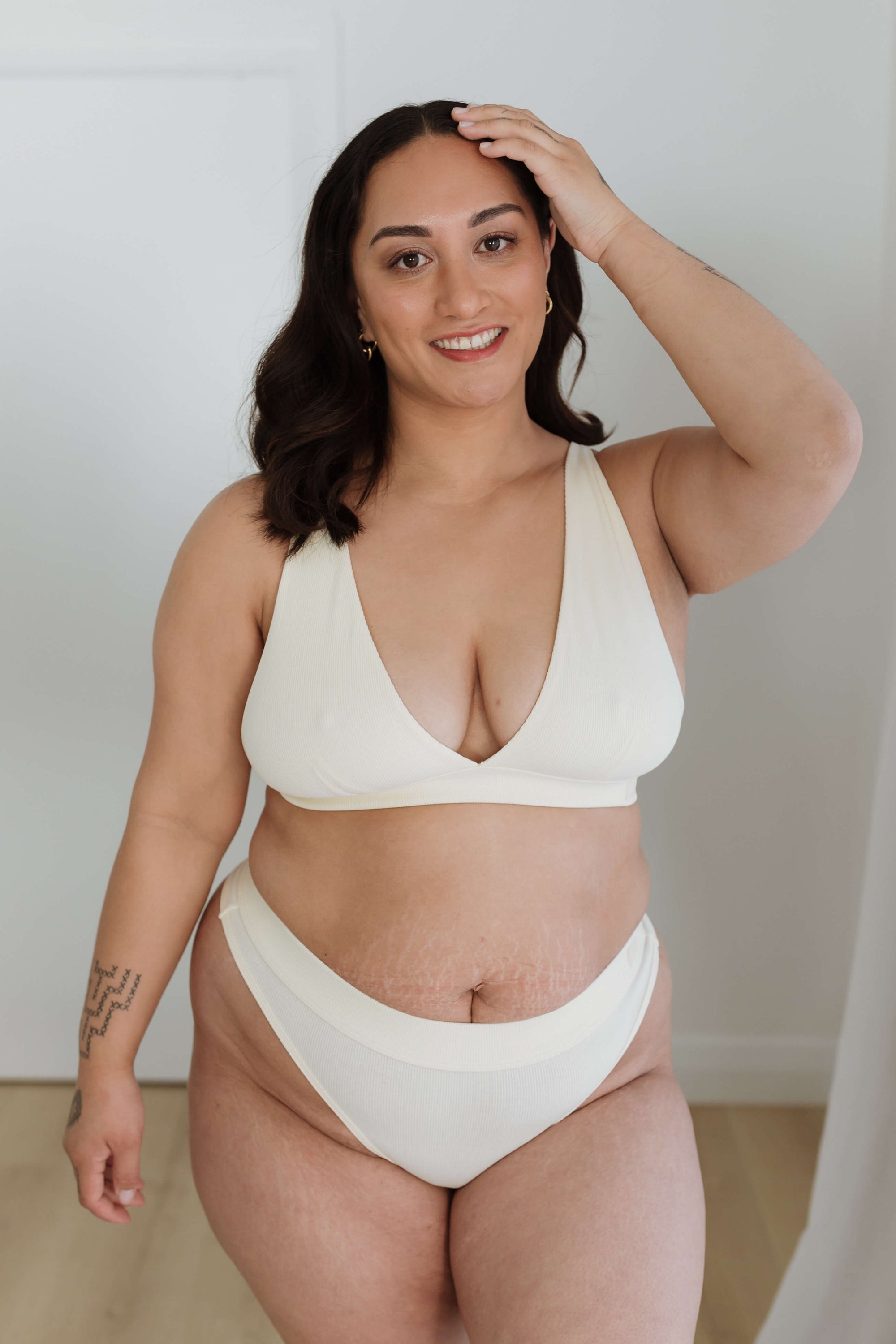 MODELLING A CREAM SET PLUNGE BRA + THONG FOR COMFORT