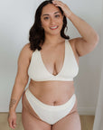 MODELLING A CREAM SET PLUNGE BRA + THONG FOR COMFORT