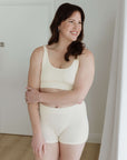 Modelling comfy cream set scoop neck bra and boy shorts medium