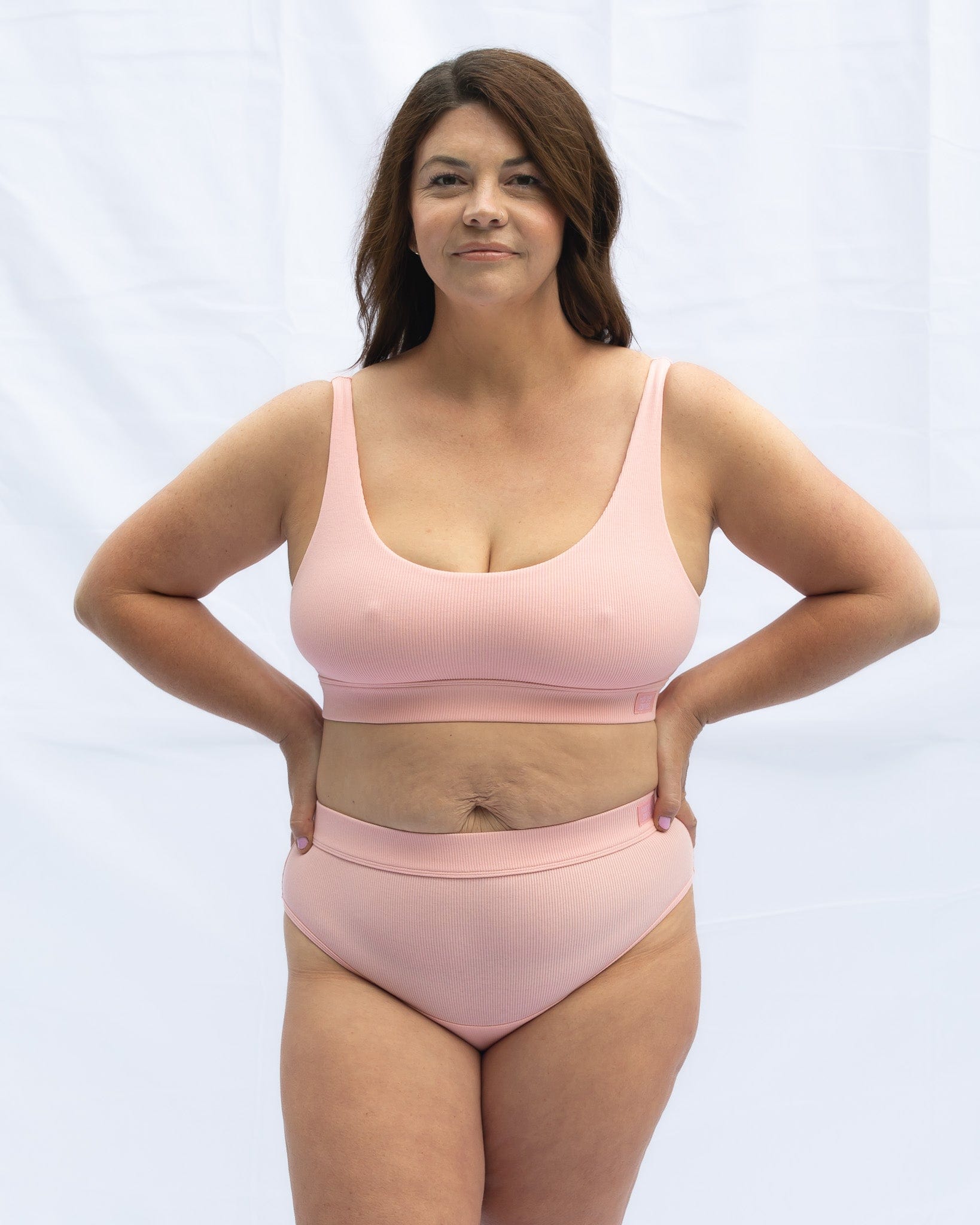 Front view modelling the scoop neck blush pink bra combined with the everyday brief