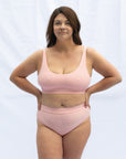 Front view modelling the scoop neck blush pink bra combined with the everyday brief