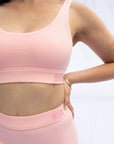 Side view of the bra in blush pink plus everyday briefs